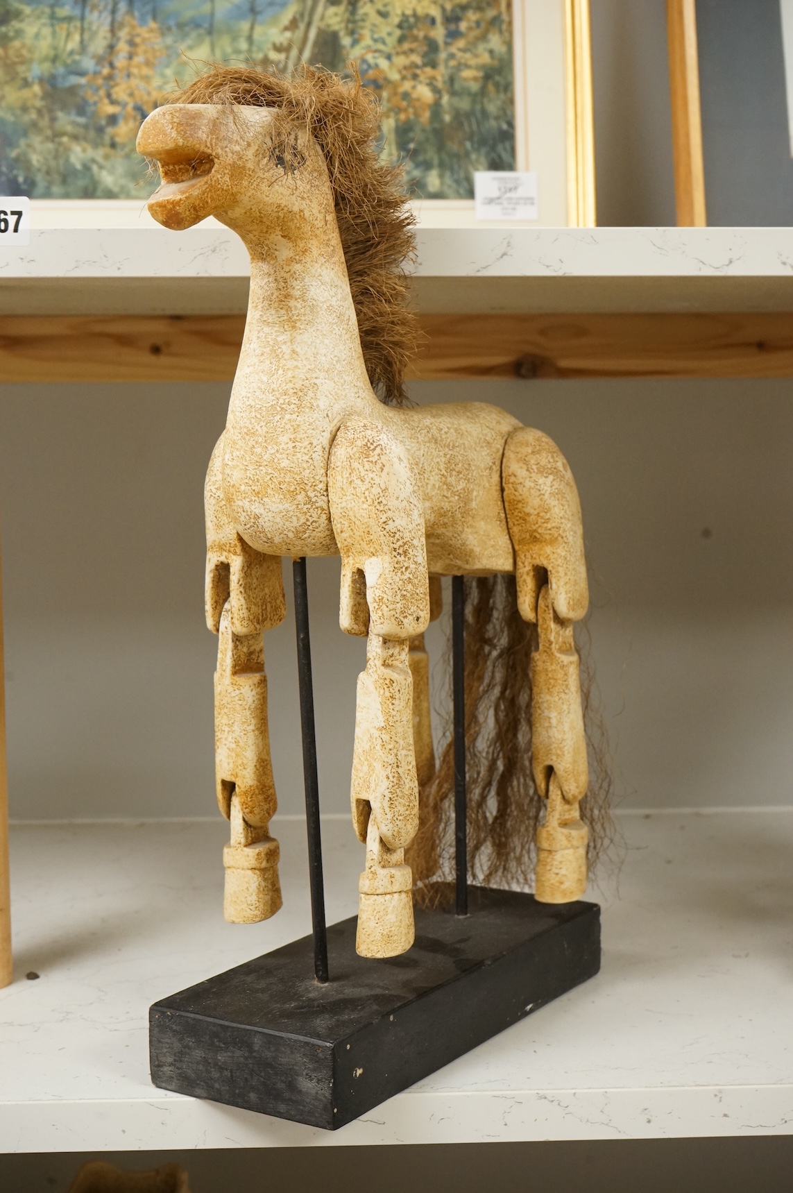 A painted composition articulated model horse, on stand, 42cm